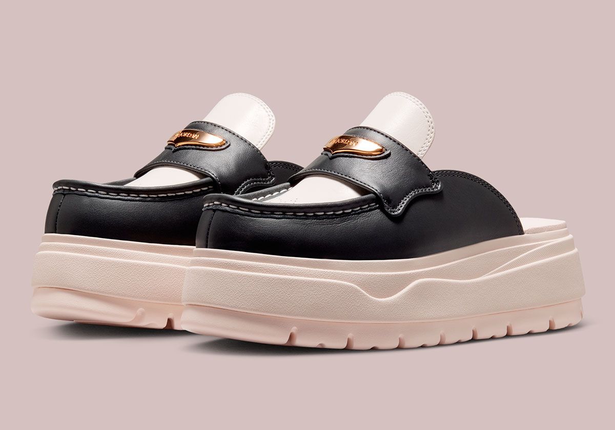 Air Jordan Mule in Chalk and Off Noir with ornamental brogue perforations on the toe box and metallic gold hardware