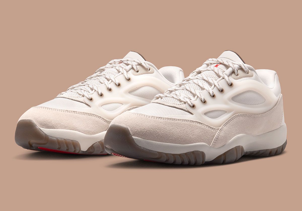 Jordan Dimension 95 Phantom showing perforated TPU cage, suede toe cap, and Red Swan outsole detailing