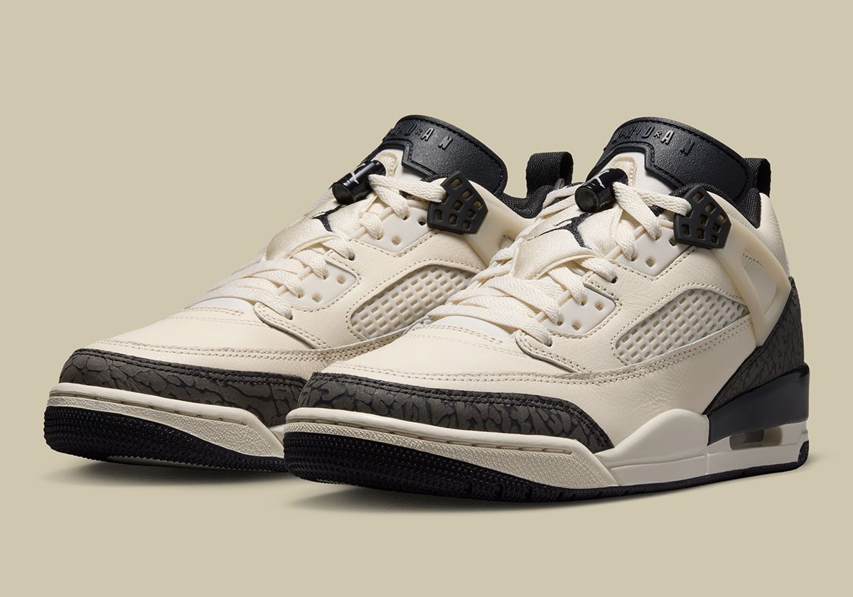 Jordan Spiz'ike Low in Chalk and Off Noir colorway, featuring off-white leather upper with elephant print accents