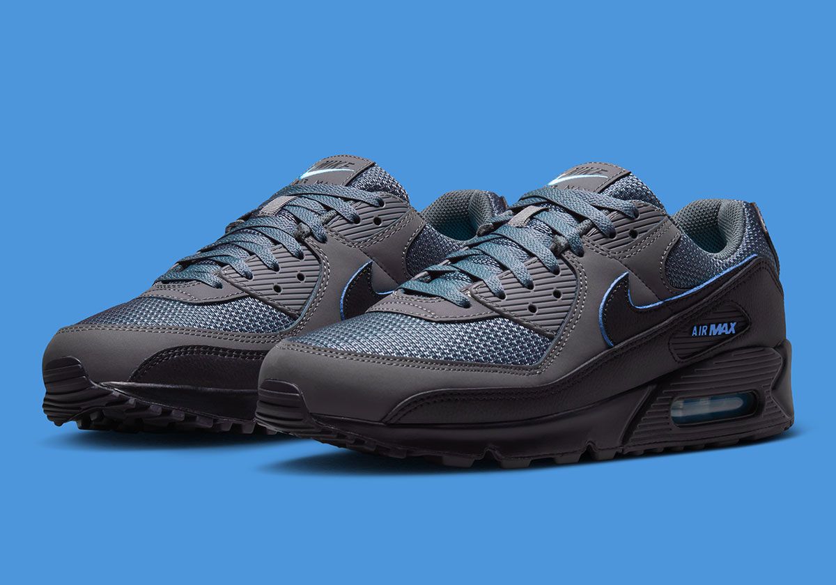 Nike Air Max 90 Football Blue with grey mesh upper, light smoke grey quarter panel, and black midsole—Fall 2026 release