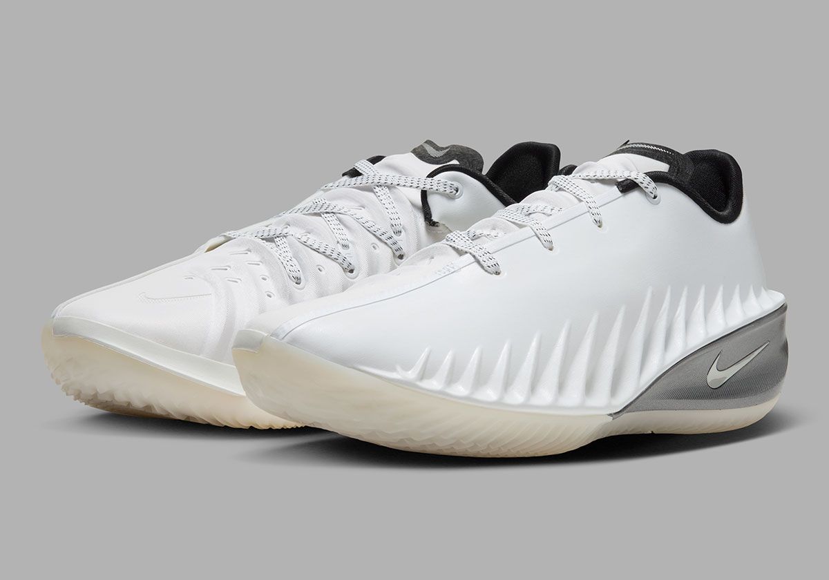 Nike GT Cut 4 SE in Summit White colorway featuring white synthetic upper, black interior, brushed metallic silver heel, and semi-translucent outsole