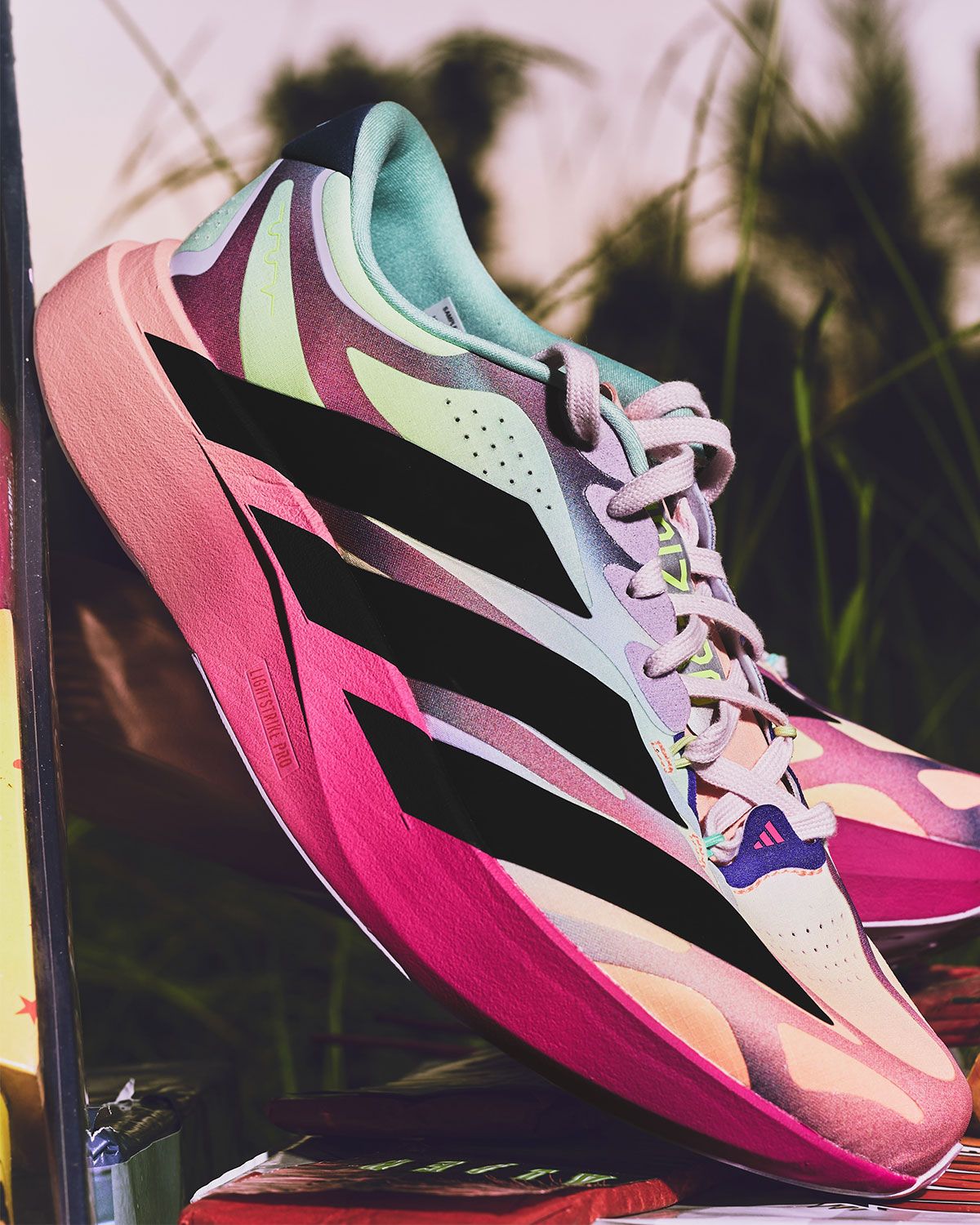 Whitaker Group x adidas EVO SL Fourth of July Pack featuring three neon gradient colorways with contrasting stripes and co-branded details