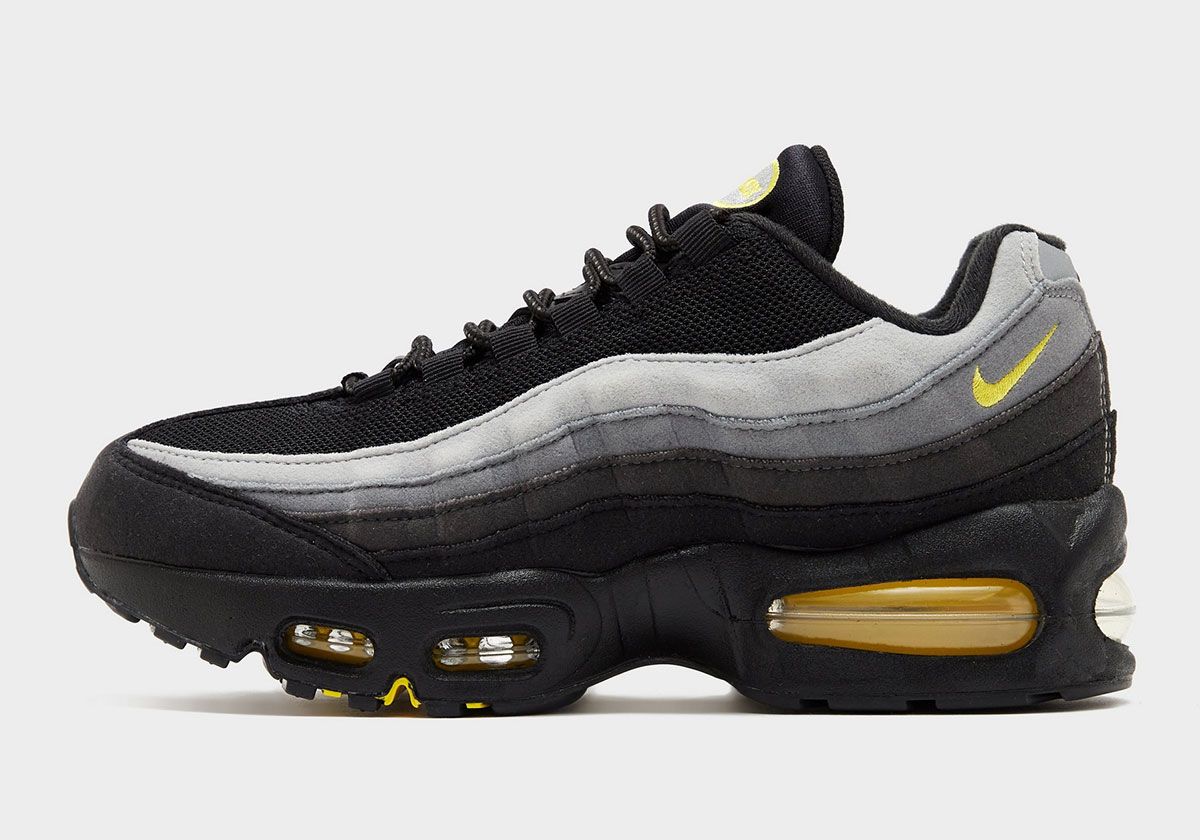 Nike Air Max 95 Big Bubble in grey suede with black midsole and chrome yellow accents, Batman-inspired colorway