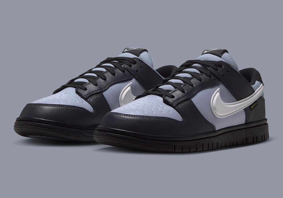 Nike Dunk Low GORE-Tex in Oil Grey colorway showing dark overlays, white Swoosh, and reinforced traction platform