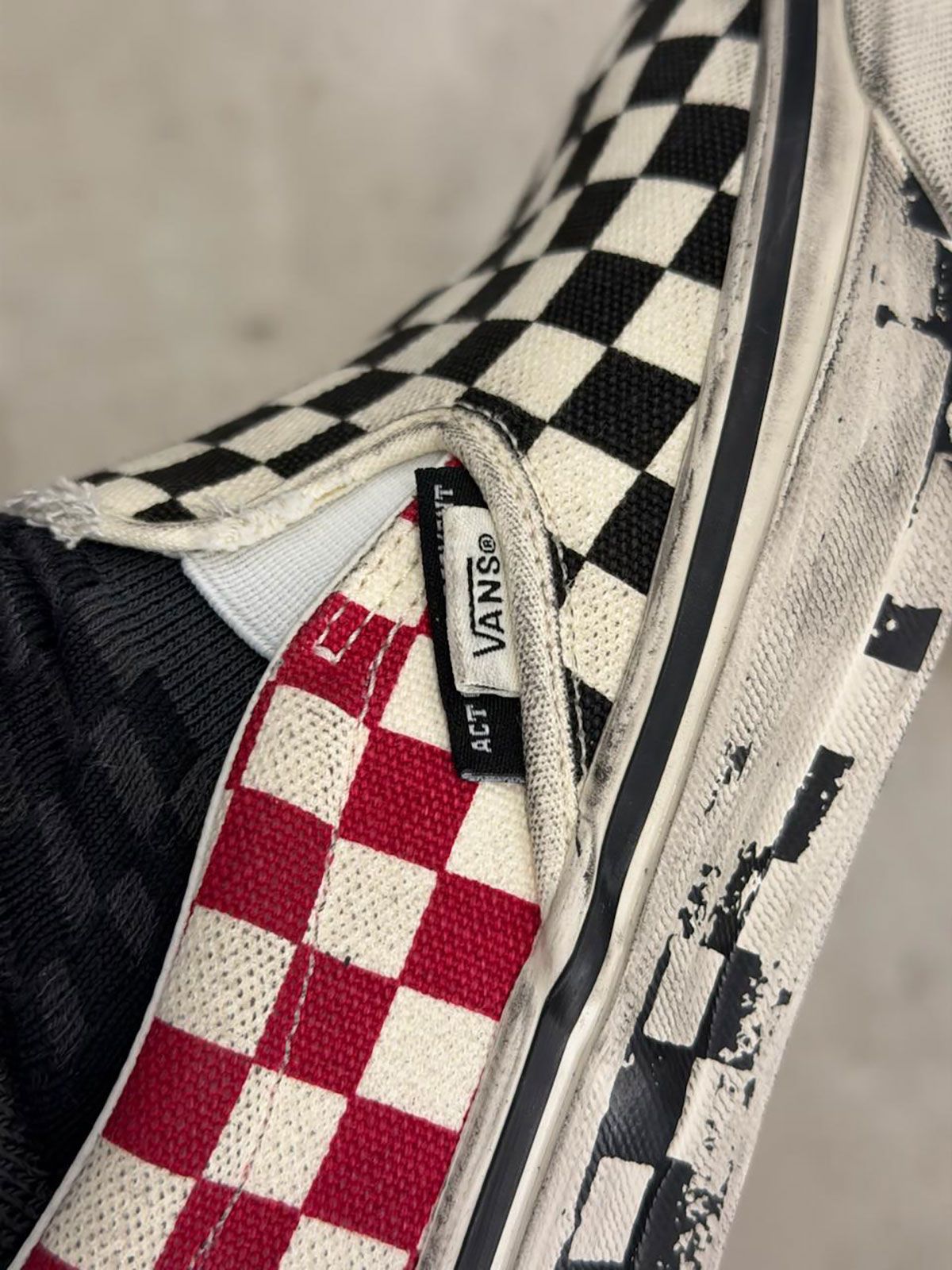 Slam Jam x Vans Slip-On collaboration in white and red checkerboard with distressed canvas and aged midsole detailing