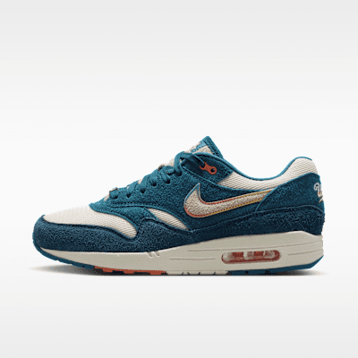 Nike Air Max 1 "Brewers" in Industrial Blue, Light Wild Mango, and Natural colorway, showing the visible Air unit in the translucent sole