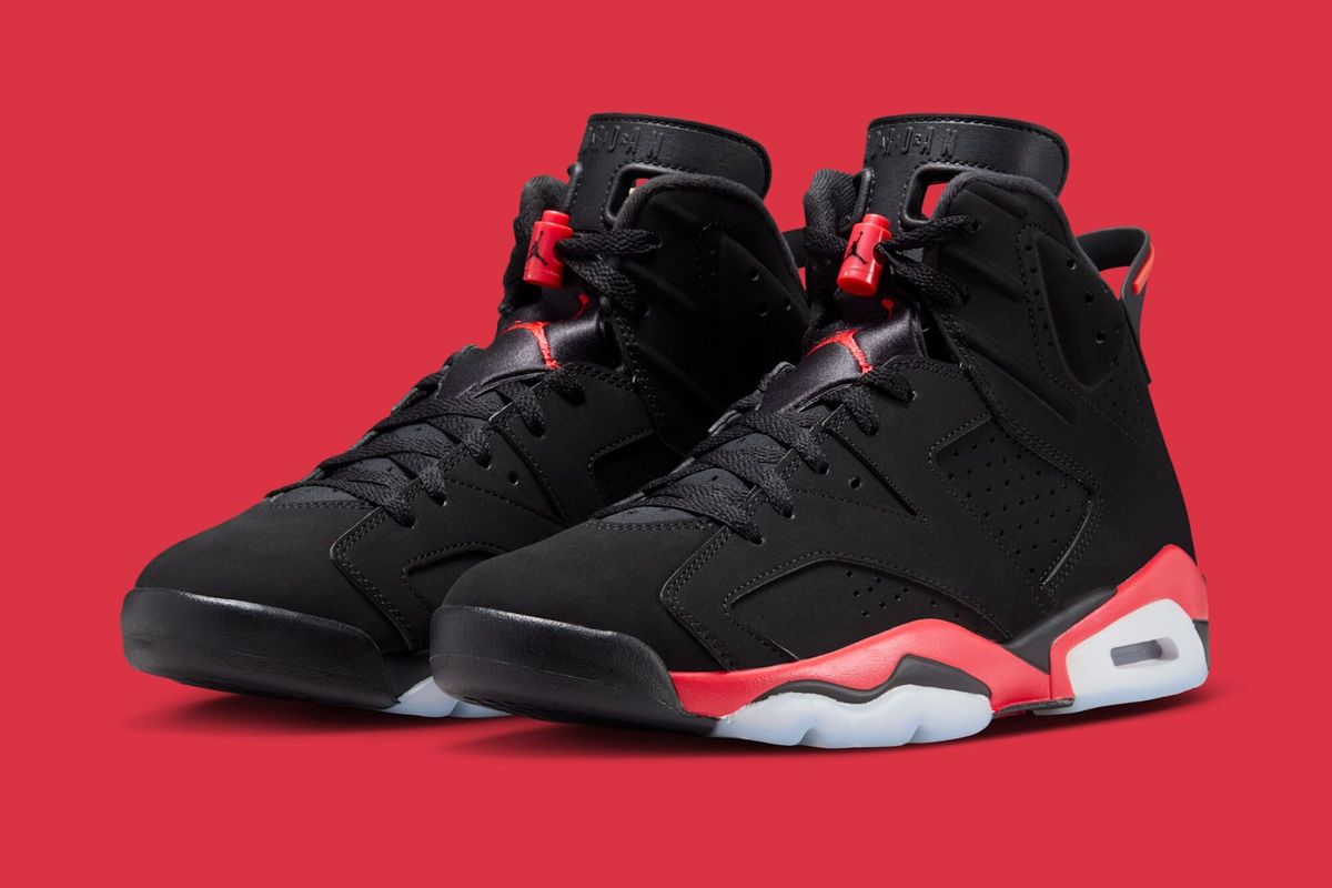Air Jordan 6 Infrared retro sneaker in black and red, side profile view showing the iconic silhouette and Jumpman branding