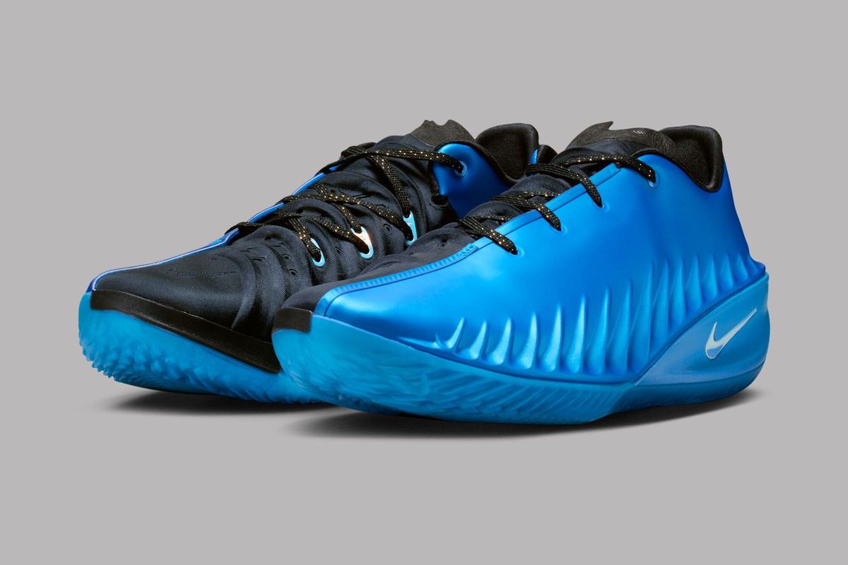 Nike G.T. Cut 4 in Photo Blue colorway, side profile view of basketball performance shoe