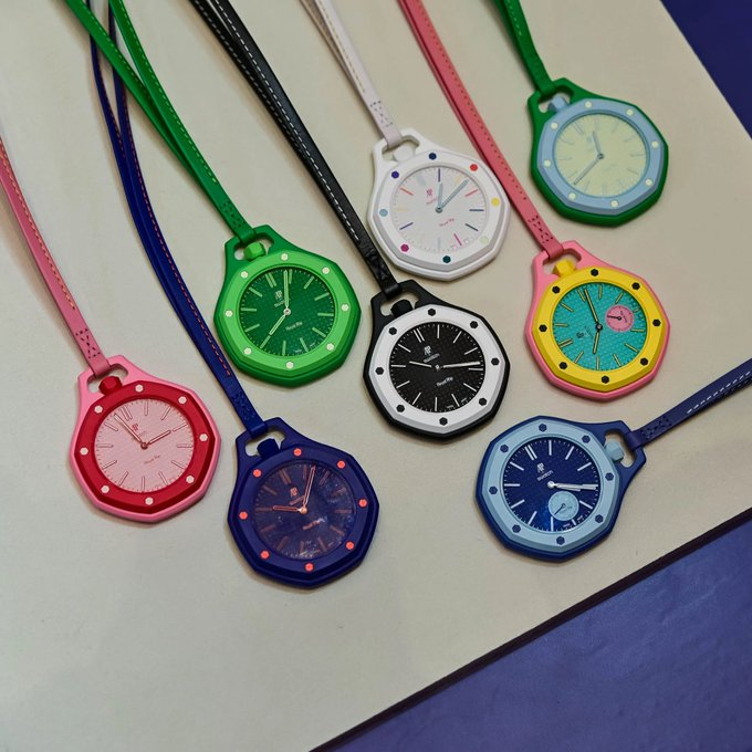 Swatch x Audemars Piguet Royal Pop collection — eight colorways arrayed on a tabletop.
