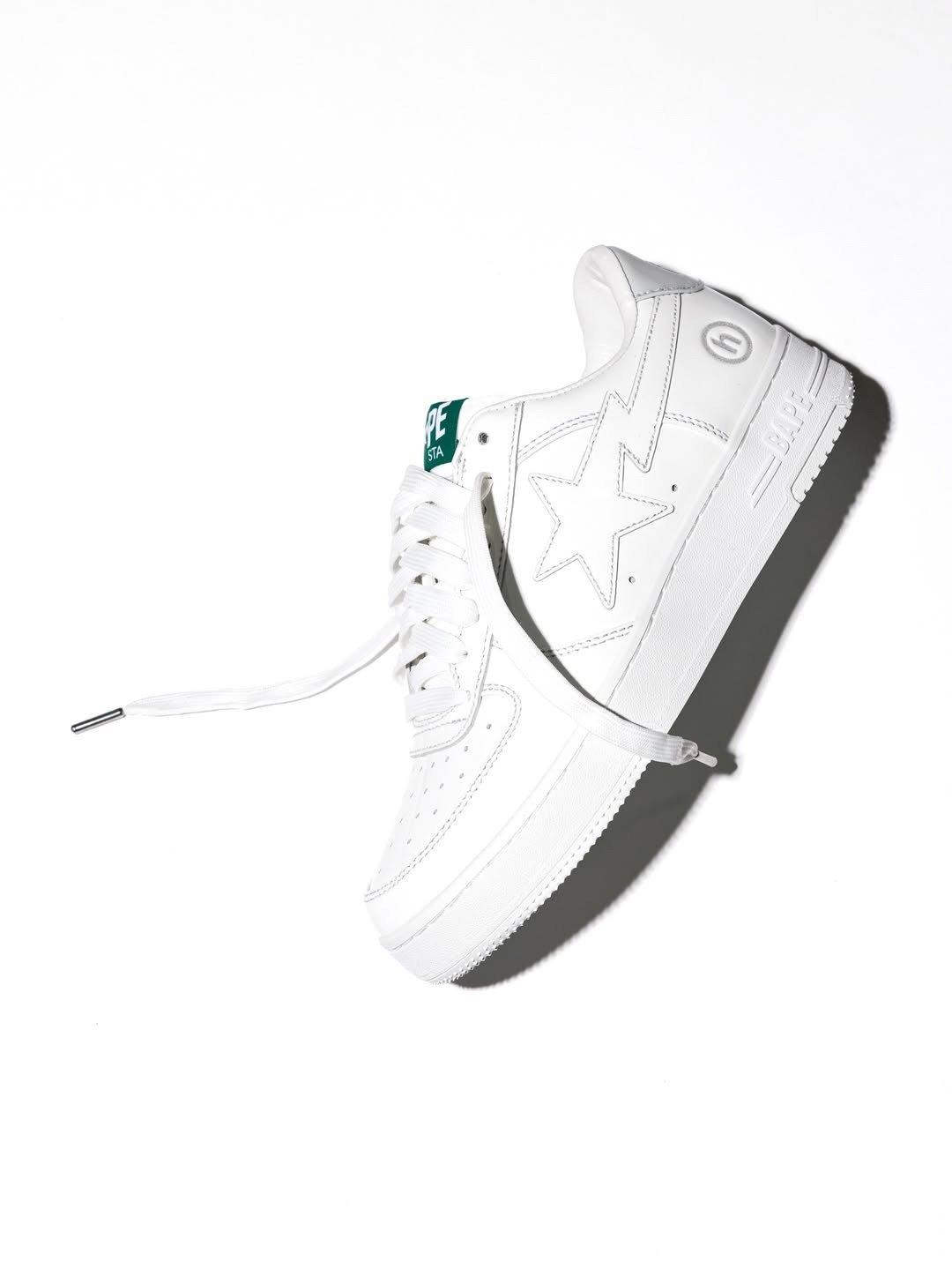 Hidden NY x BAPE STA in white leather, showcasing clean upper construction and collaborative branding - detail view 2