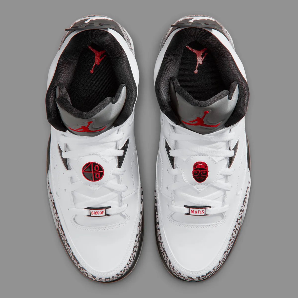Jordan Son of Mars Low in White Cement colorway, showcasing white canvas upper with grey cement paneling and tonal midsole - detail view 4