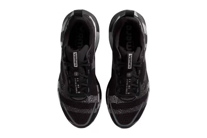 Nike Vomero 18 DSRPT in Iron Grey, Light Smoke Grey, and Black colorway showing abstract two-tone design on running shoe upper - detail view 5