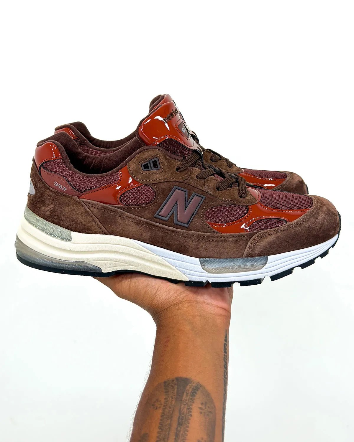Amine x New Balance 992 Outdoor School in brown suede with red patent leather panels and blue sole accents
