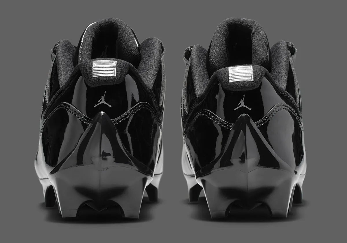 Air Jordan 11 Football Cleat in Anthracite colorway with patent leather collar and carbon fiber shank detail - detail view 4