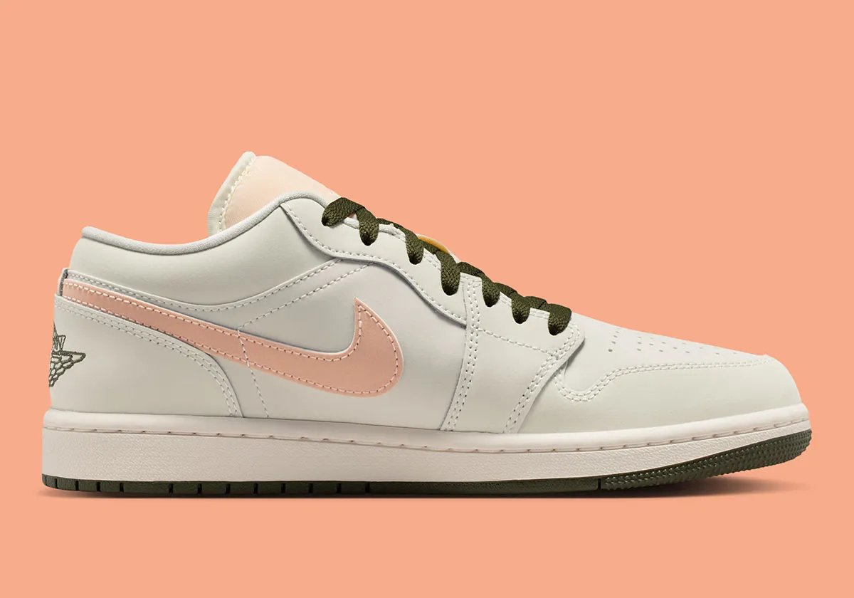 Nike Air Jordan 1 Low in Crimson Tint colorway, showing leather construction and ankle collar detail - detail view 2