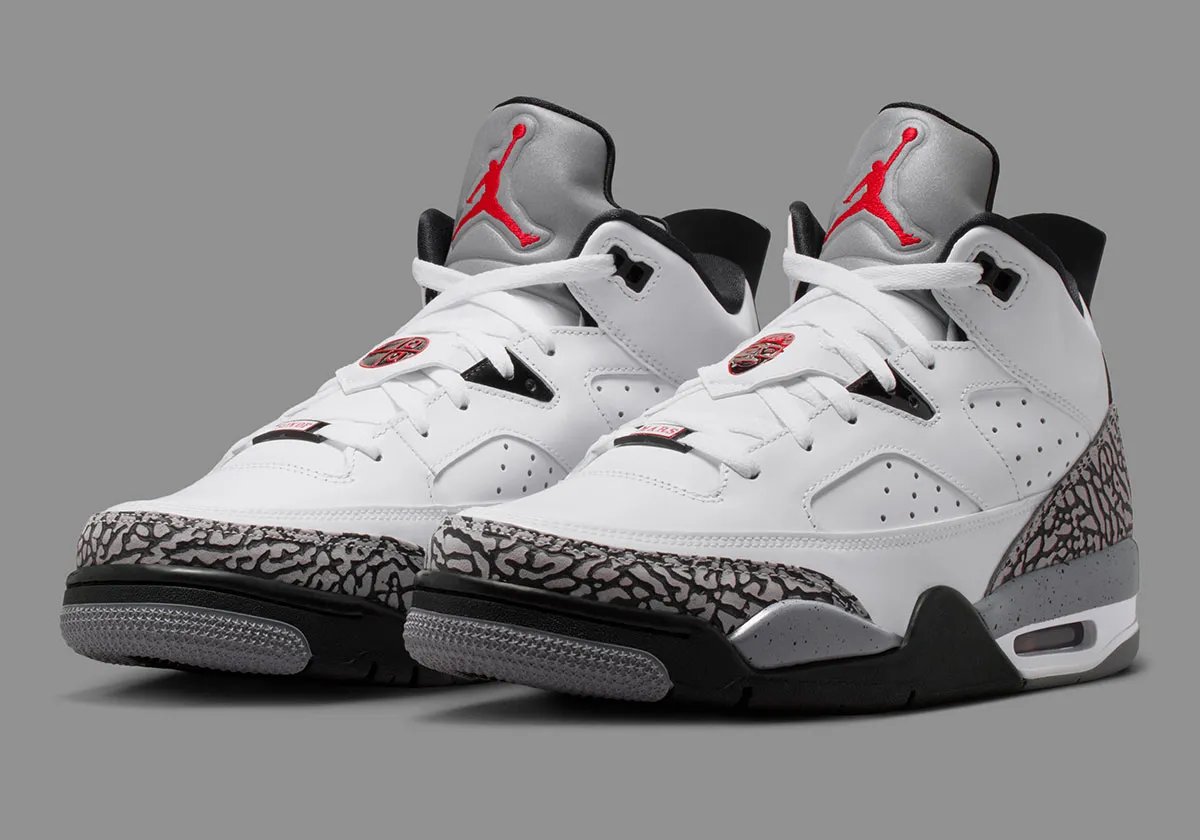 Jordan Son of Mars Low in White Cement colorway, showcasing white canvas upper with grey cement paneling and tonal midsole - detail view 1