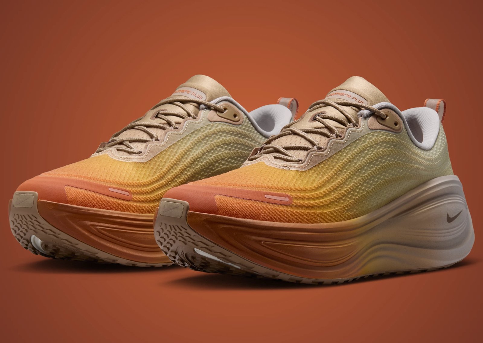Nike Vomero Plus Cheat Day showing orange-to-grey gradient with Cheeto-inspired insole graphics - detail view 1