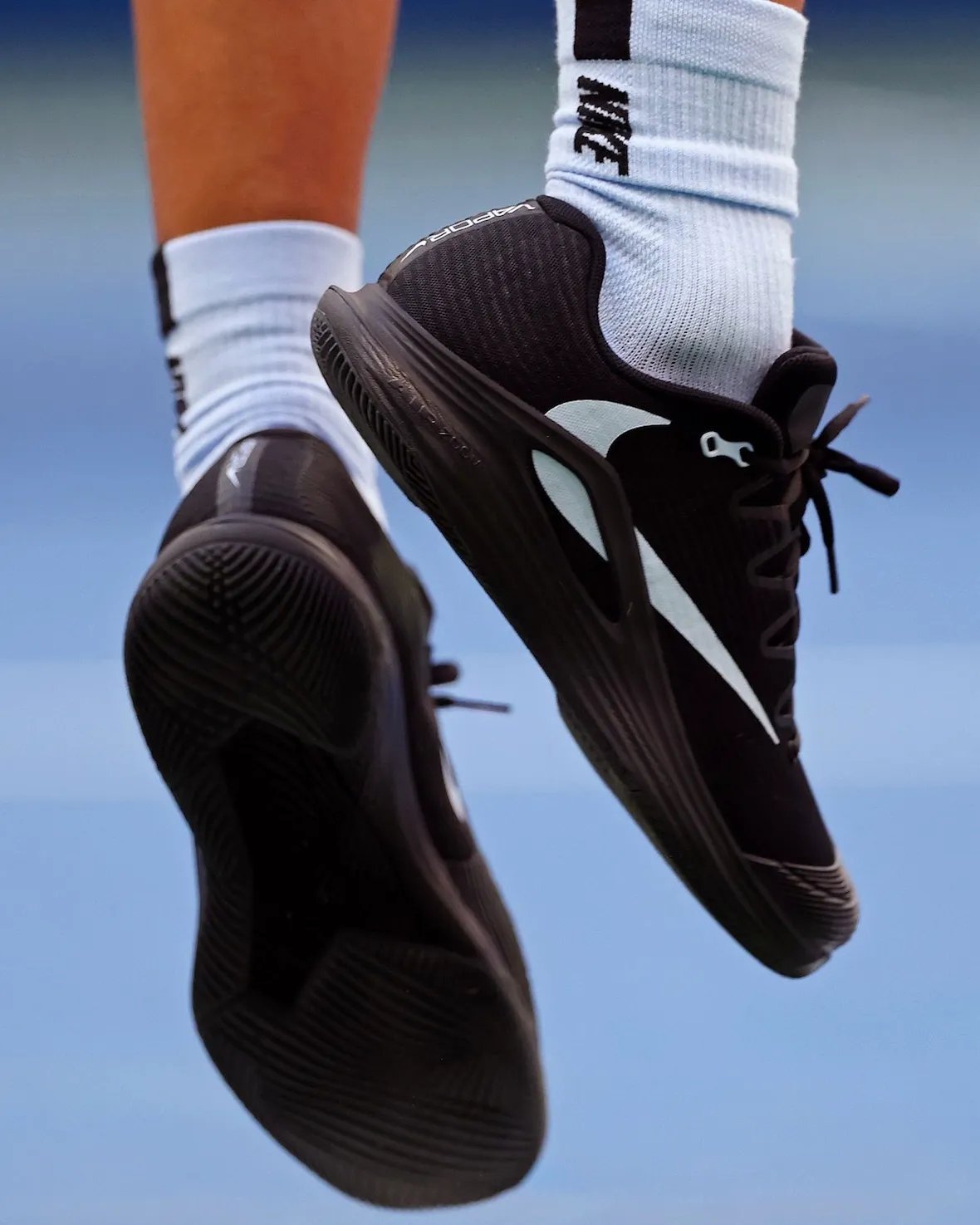 Carlos Alcaraz wearing black Travis Scott x Nike Zoom Vapor 12 with white Reverse Swoosh detail - detail view 2