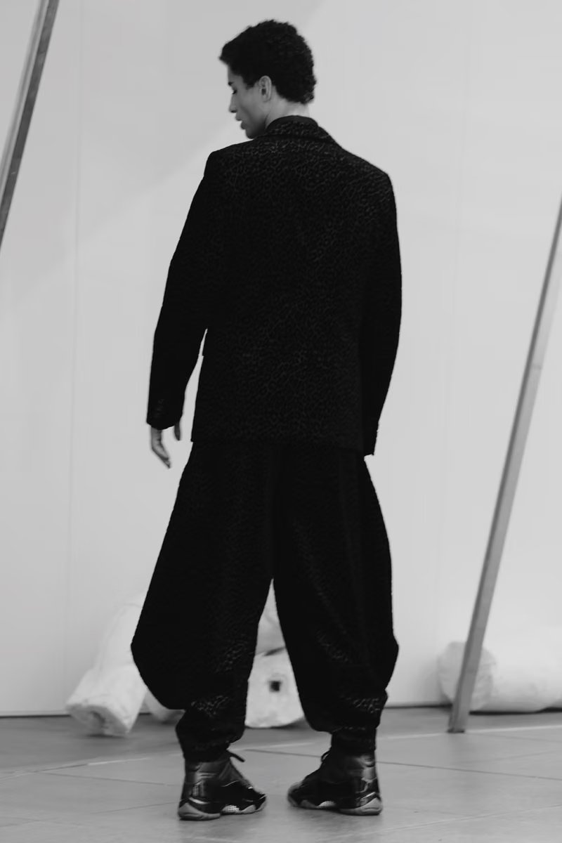 COMME des GARÇONS Homme Plus x Air Jordan 11 in Black with premium full-grain leather and gloss midsole, September 2026 release - detail view 3