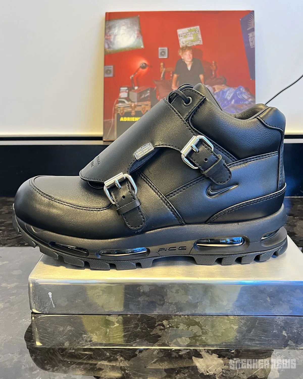 Public School NY x Nike Air Goadome in Triple Black with oversized metal buckle hardware detail on leather tongue - detail view 1