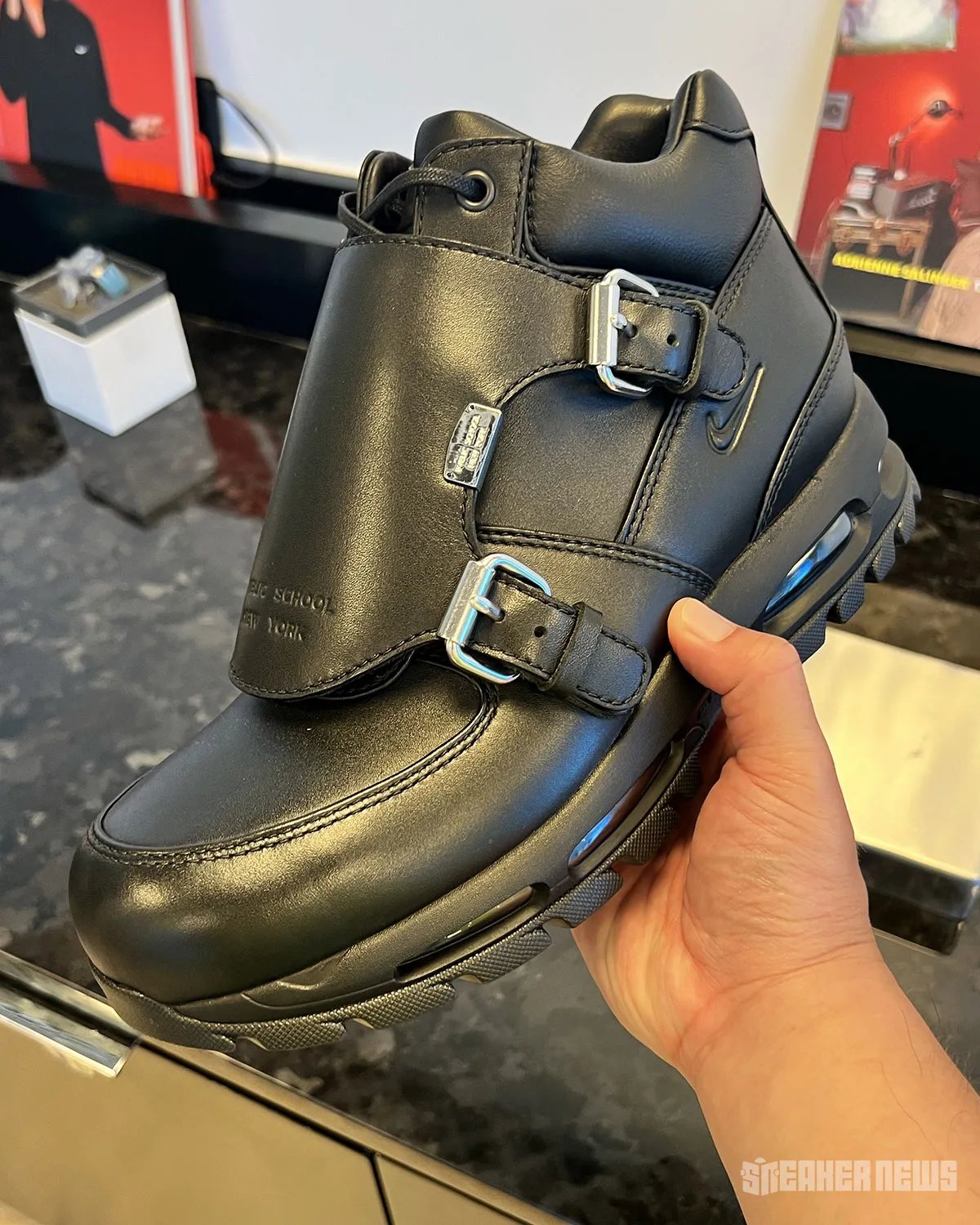 Public School NY x Nike Air Goadome in Triple Black with oversized metal buckle hardware detail on leather tongue - detail view 3