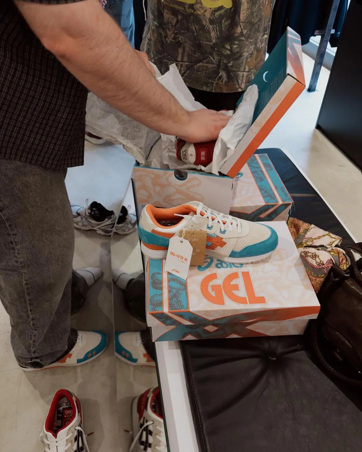 ASICS GEL-Lyte III Remastered in coral, featuring split tongue design and commemorative branding - detail view 3