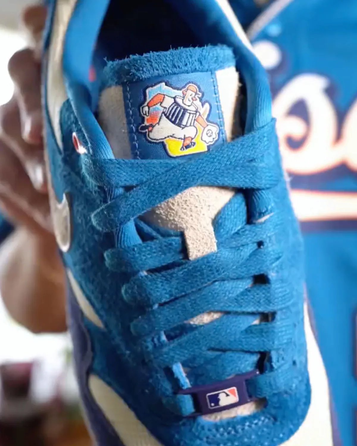 Nike Air Max 1 in Brewers City Connect colorway featuring blue suede upper with rainbow-trimmed Swoosh - detail view 2