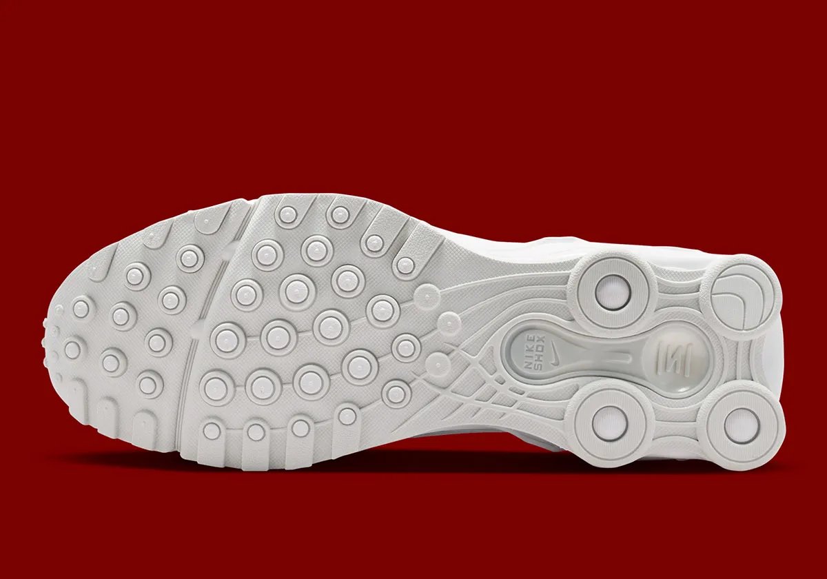 Nike Shox Ride 2 in Triple White colorway, showing full white upper, midsole, and visible Shox cushioning units - detail view 5