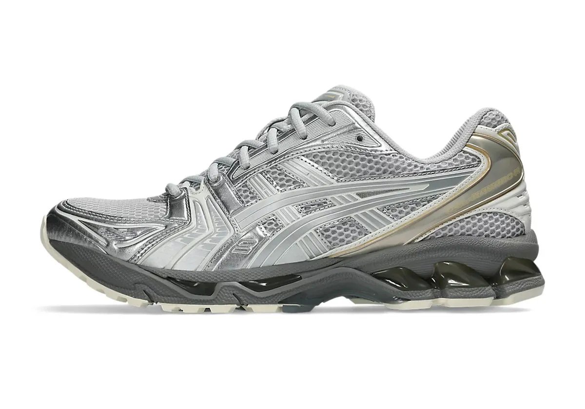 ASICS GEL-Kayano 14 in Concrete colorway, showing neutral tonal upper with reinforced medial support structure - detail view 1