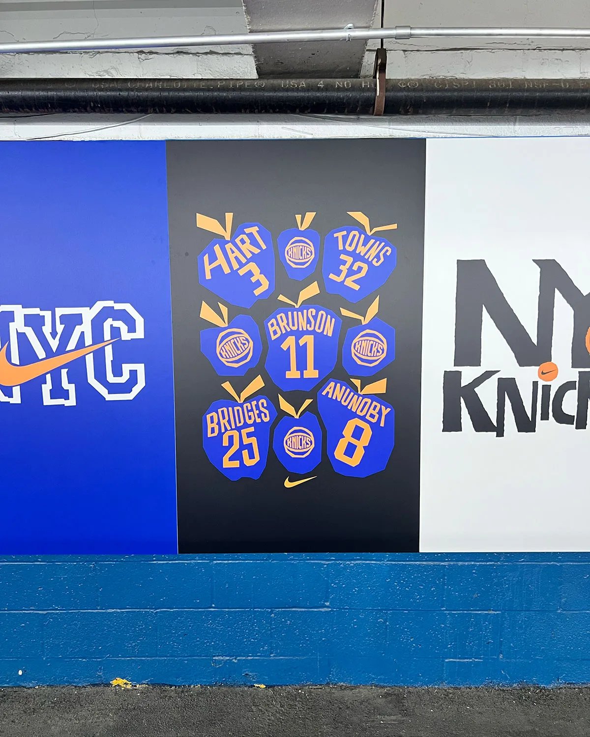 Nike Park N Shop pop-up activation inside Park N Lock garage near Madison Square Garden, featuring custom orange and blue ice cream truck design with vintage Knicks merchandise and hanging Nike Dunks - detail view 3
