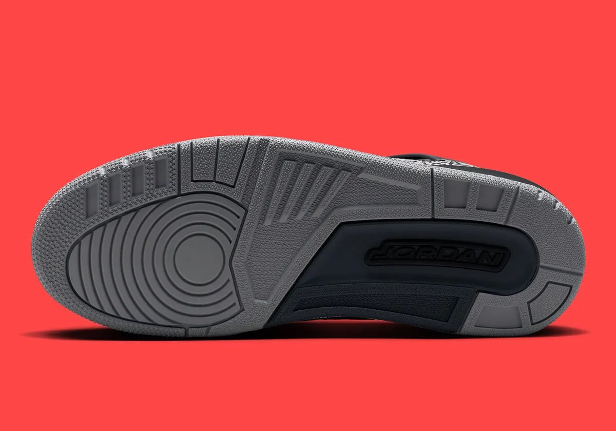 Jordan Spiz'ike Low in Infrared colorway, side profile view showing mixed-material upper construction and distinctive lace toggle detail - detail view 2
