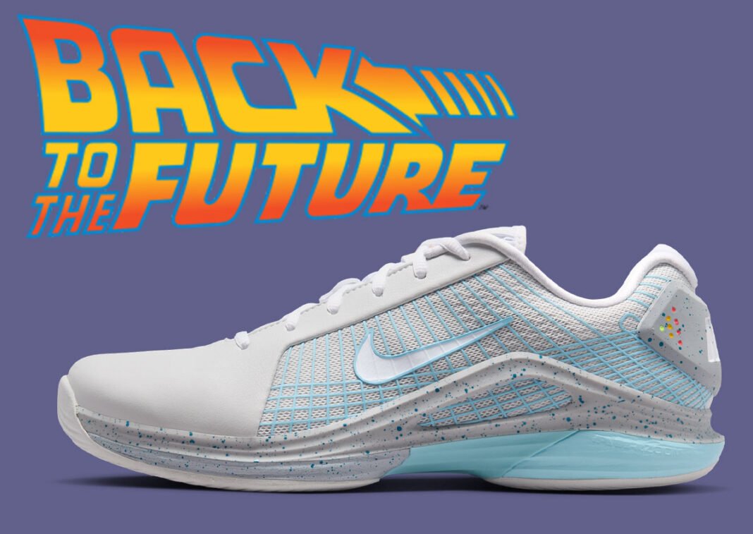 Nike Zoom Vapor 12 Hypersmash in Photon Dust, Wolf Grey, Sky Blue and White, featuring Back to the Future 'Mag' theme with illuminated heel graphics and orange-to-yellow gradient tongue logo - detail view 1