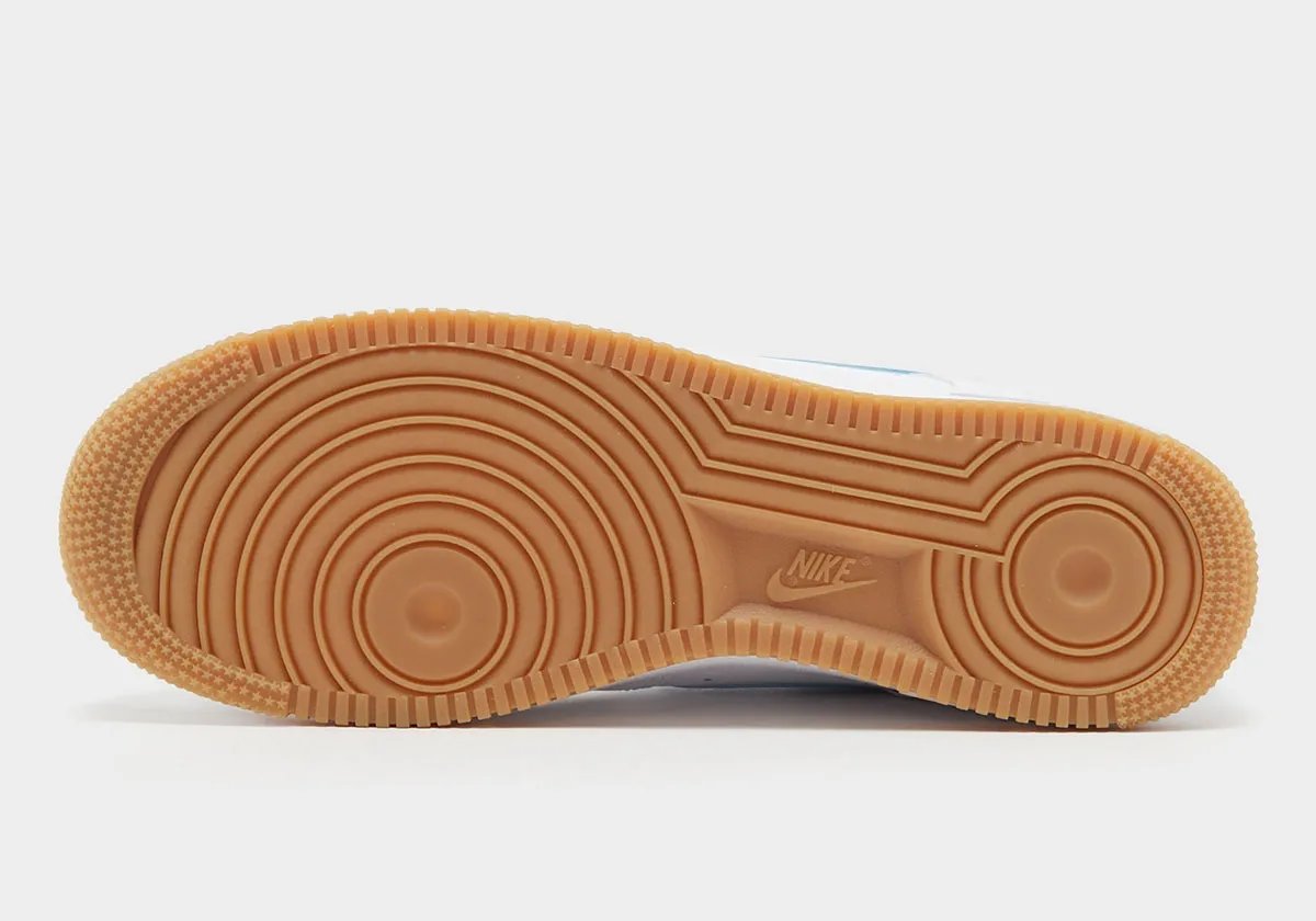Nike Air Force 1 Low Aurora Blue with white leather upper, blue accents, and gum rubber sole - detail view 4
