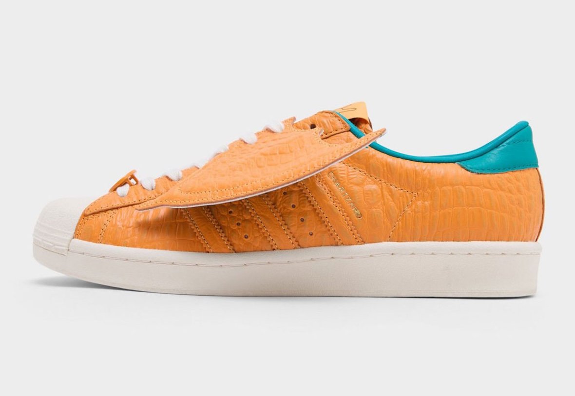 adidas Superstar with Charizard design featuring orange textured leather and removable leather wings - detail view 4