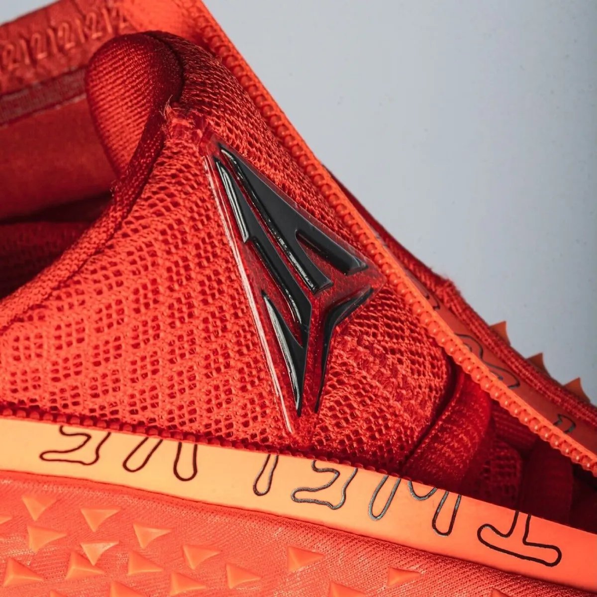 Nike Ja 4 High in University Red with zippered shroud and textured TPU details - detail view 3