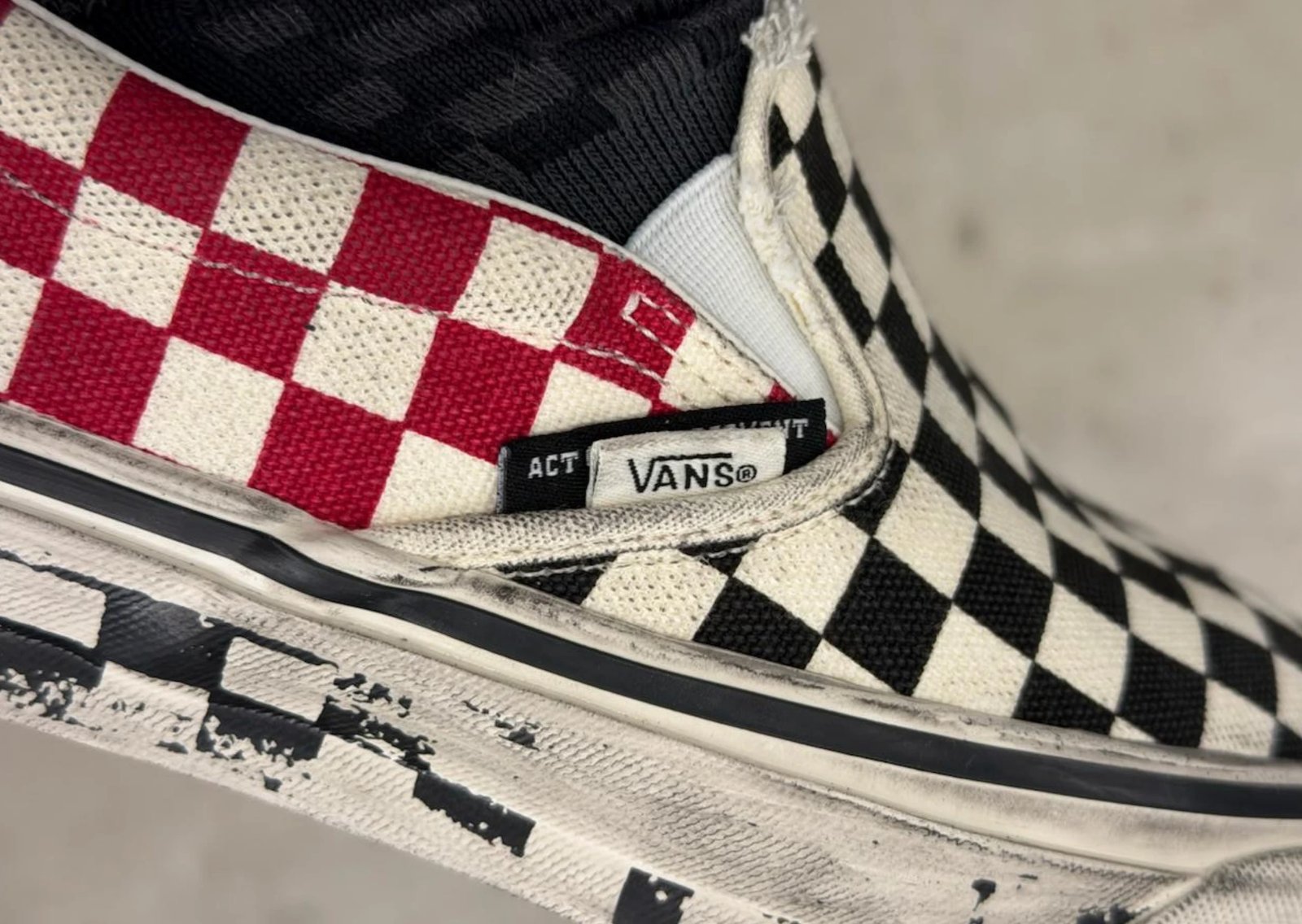 Slam Jam x Vans Classic Slip-On Act of Disagreement featuring dual checkerboard patterns in black-white and red-white colorways with distressed detailing - detail view 1