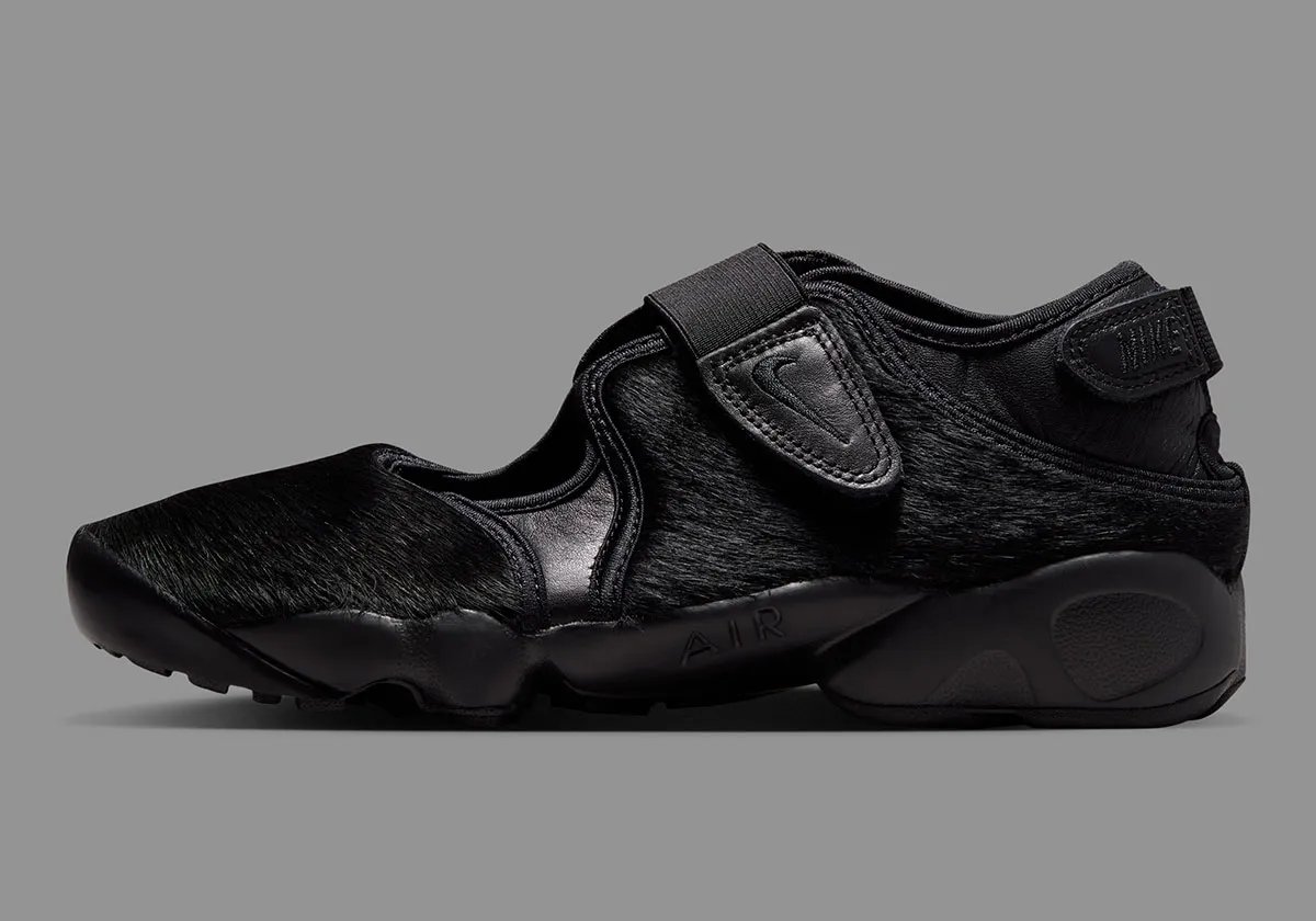 Nike Air Rift Pony Hair Pack in black colorway with tabi toe design and pony hair texture upper - detail view 1