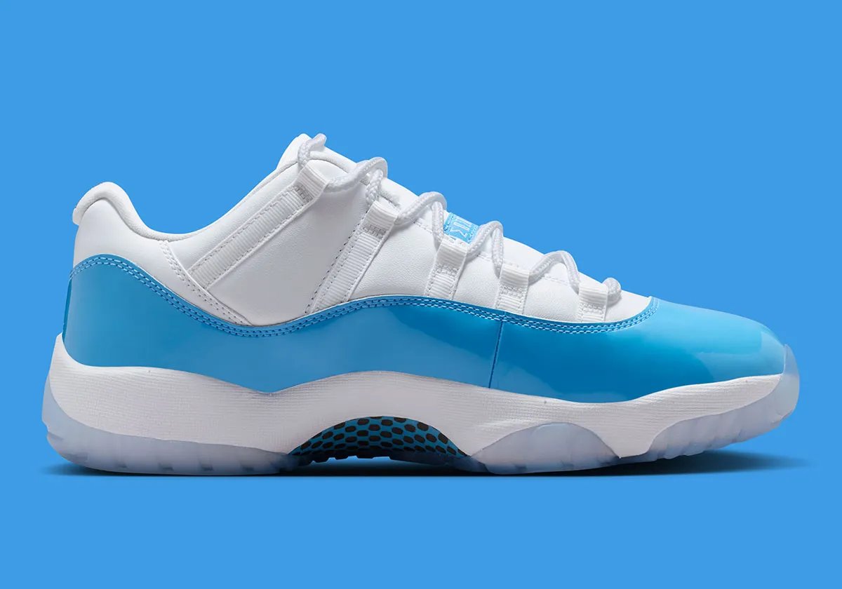 Air Jordan 11 Low in University Blue and white, showing mudguard detail and icy translucent sole - detail view 2