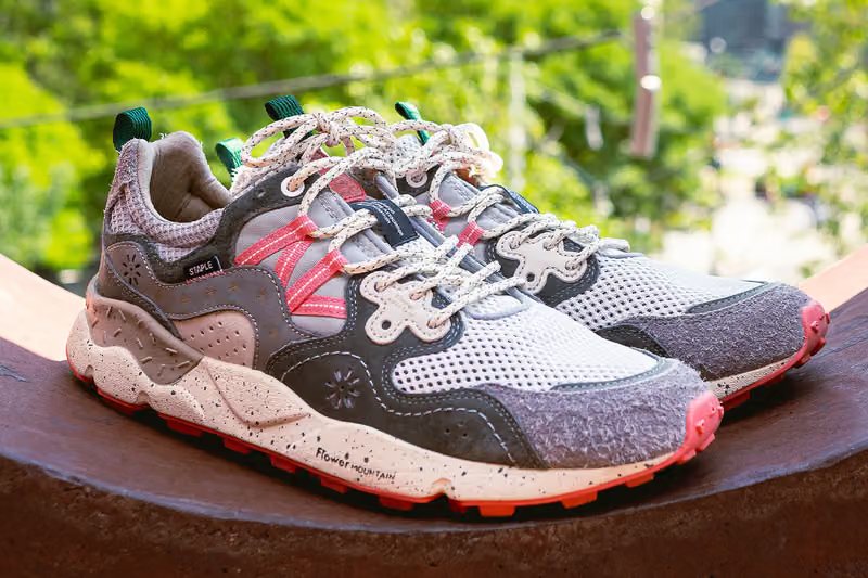 Flower Mountain x Staple Yamano 3 sneaker featuring floral and pigeon embroidery in charcoal grey, dusty coral, and orange