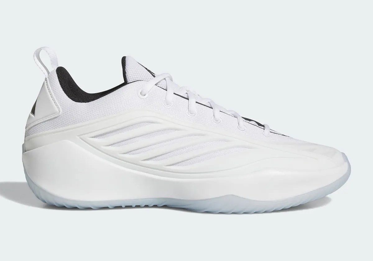 adidas Believe That 1 in Footwear White colorway with black trim and translucent traction, shown on-court - detail view 1