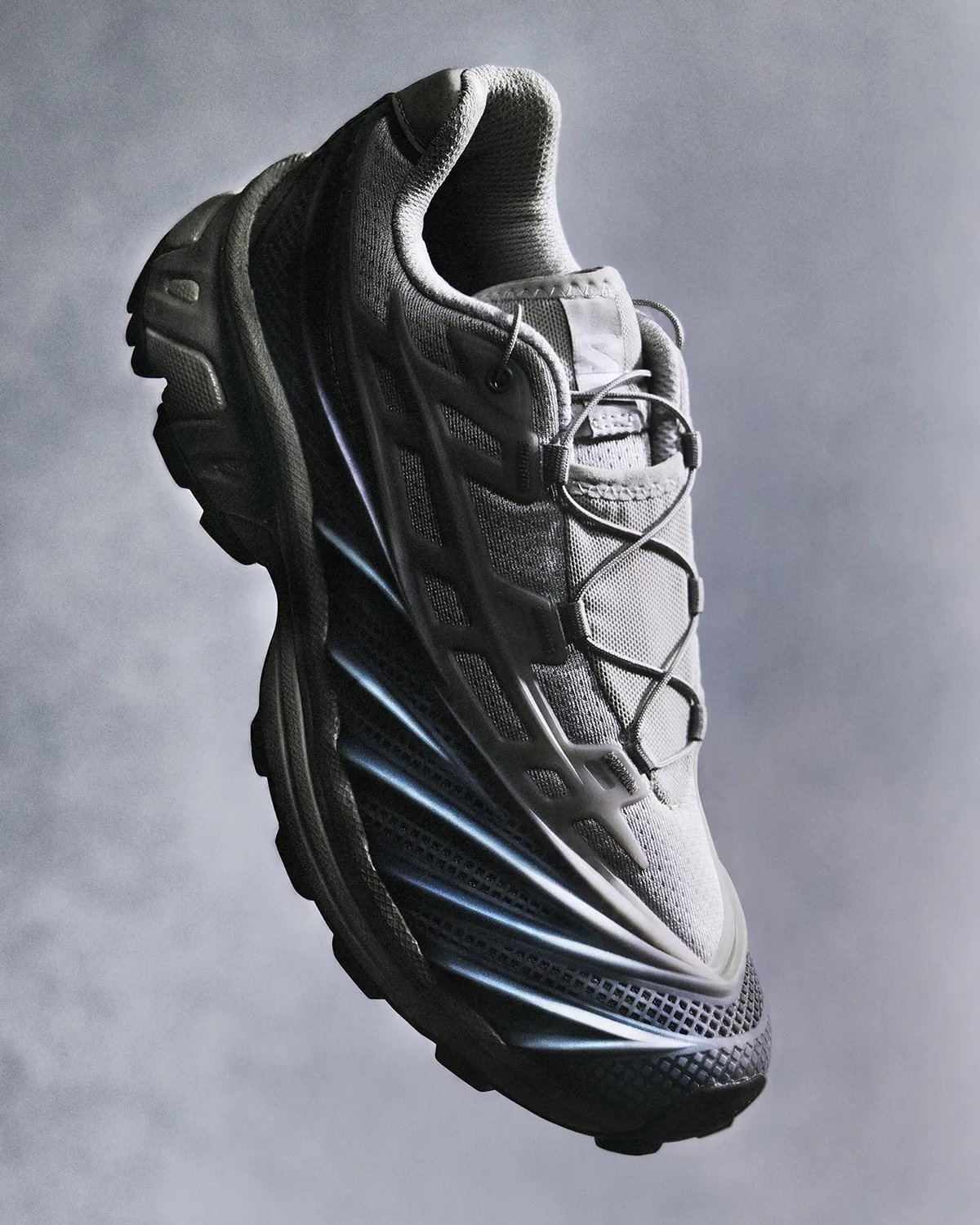 Salomon XT-EVO featuring liquid rubber cage construction in Black/Fiery Red colorway