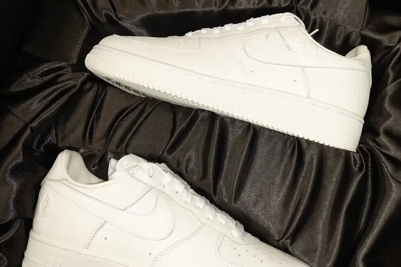JAY-Z x Nike Air Force 1 Low 'Reasonable Doubt' triple-white sneaker with embossed Roc-A-Fella branding and custom heel graphics - detail view 3