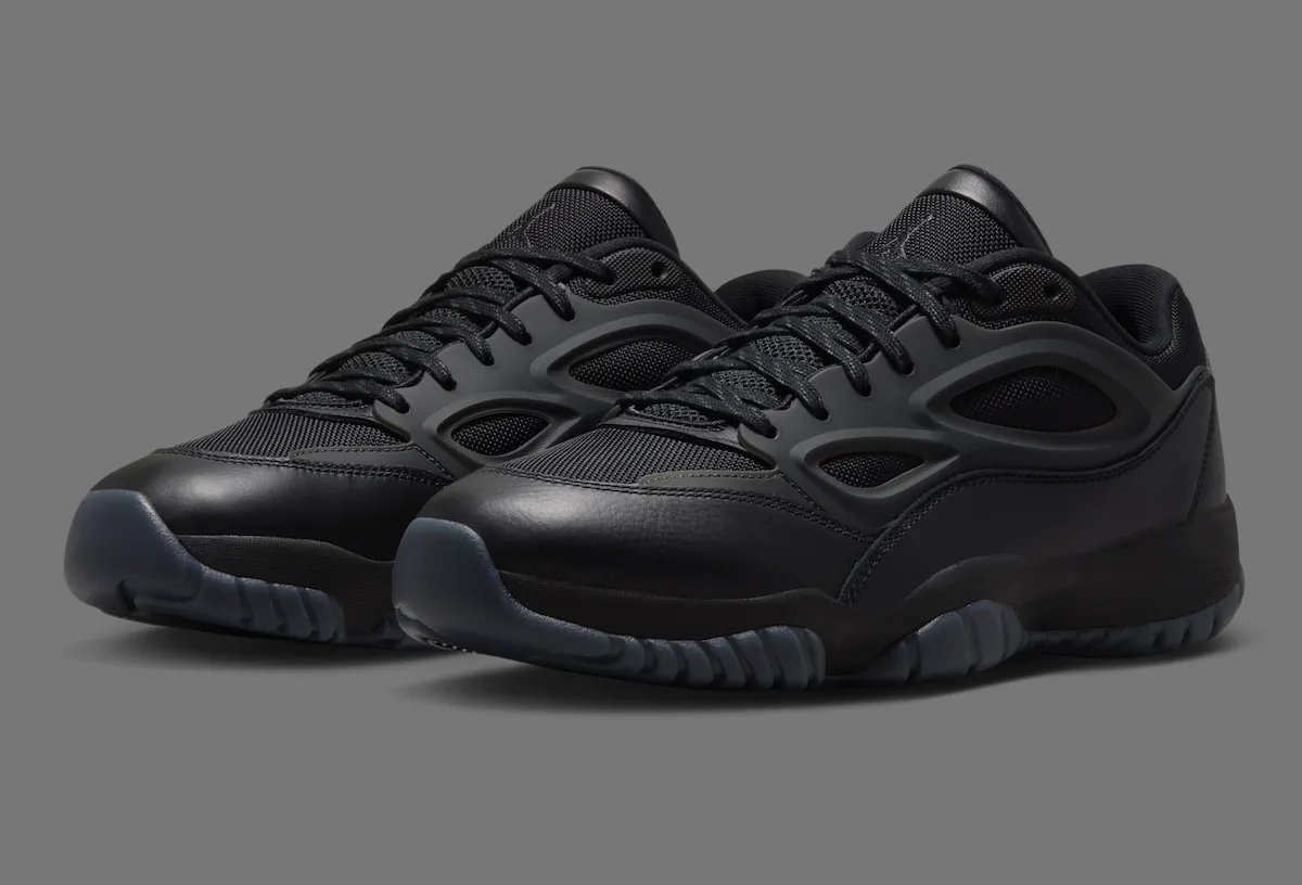 Jordan DMSN 95 in Black/Dark Smoke Grey showing mesh upper and molded TPU cage detail - detail view 2