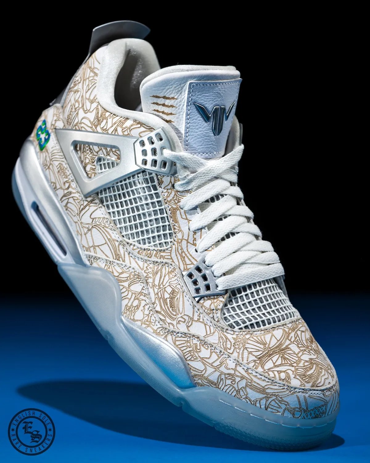 Maya Moore's custom Air Jordan 4 "Laser" PE in white leather with laser engraving and Minnesota Lynx team color accents - detail view 3