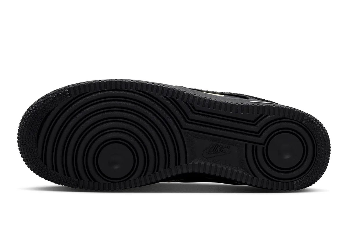 Nike Air Force 1 Low in black leather with cream polka dots, women's colorway, overhead view showing dot pattern across upper - detail view 2