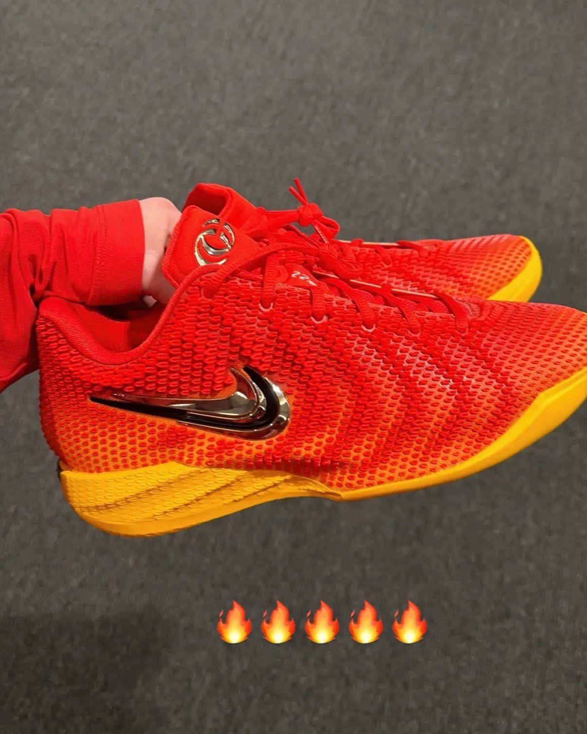 Nike Caitlin 1 Chiefs colorway in red and gold, featuring oversized Swoosh and metallic tongue branding - detail view 3