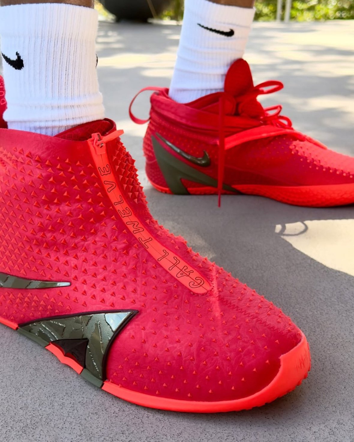 Nike Ja 4 High with wrapped exterior shell and triangular branding detail in high-top silhouette - detail view 2