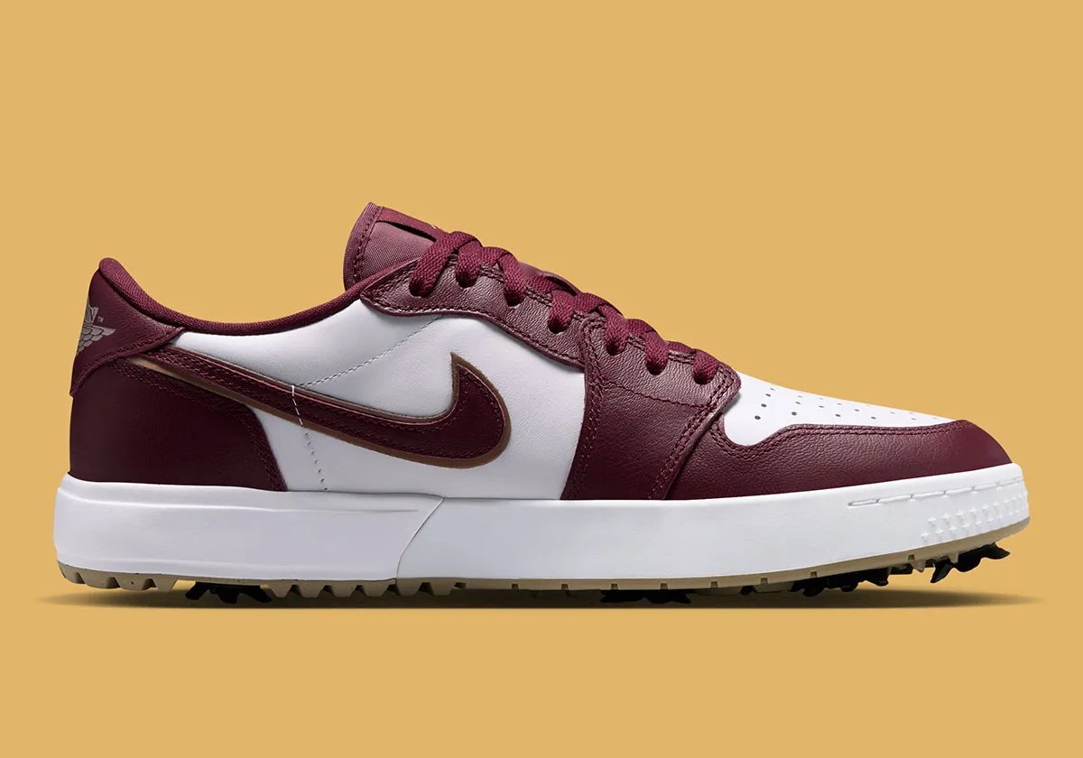 Air Jordan 1 Low Golf Spike in Dark Team Red showing burgundy overlays, khaki outsole, and strategic spike placement - detail view 3