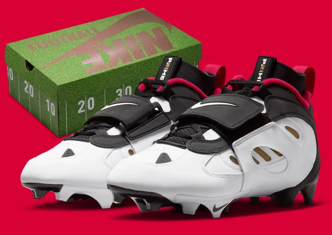 Nike Diamond Turf 2 49ers football cleat in black with prime red and metallic gold accents, Deion Sanders signature line - detail view 1