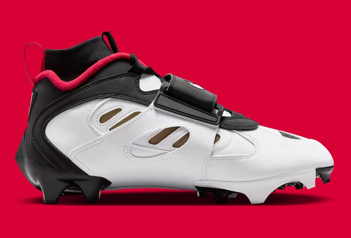 Nike Diamond Turf 2 49ers football cleat in black with prime red and metallic gold accents, Deion Sanders signature line - detail view 4